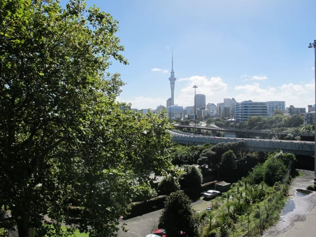 down the side roads off Karangahape Road, the Harbour Bridge and the Sky Tower.